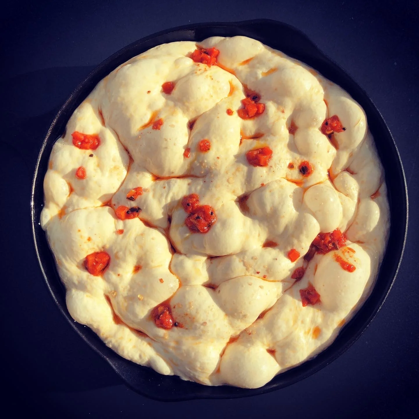 Focaccia dough topped with Spicy Carrot Pickle
